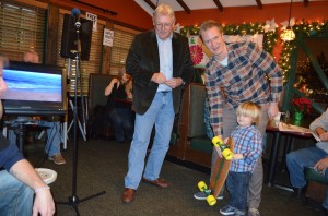 Little Dude.. John John was the lucky winner of the skateboard. Old school solid oak kicktail board donated by Oaks East .  Trucks and wheels donated by Chauncey's Surf Shop.   Made his night!